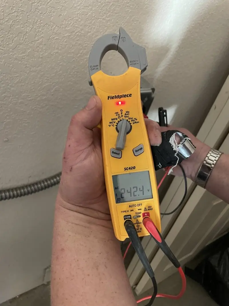 Voltage testing with clamp meter during Circuit Breaker Repair in Peppermill Village